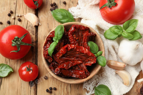 Preview: Tasty sun dried tomatoes, fresh vegetables and peppercorns on wooden table, flat lay