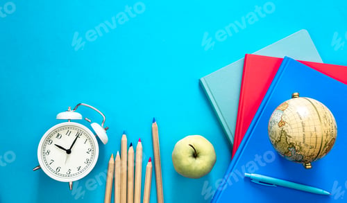 Preview: Flat lay composition with colorful educational supplies on blue background.