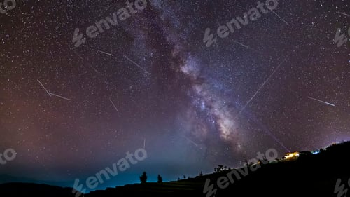 Preview: Long time exposure night landscape with the milky way during meteor shower over a mountain with hut.
