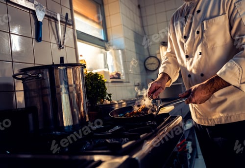 Preview: Chef cooking in a restaurant kitchen.