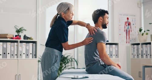 Preview: Chiropractor, back massage and physiotherapy on patient at consultation for spine problem or inflam