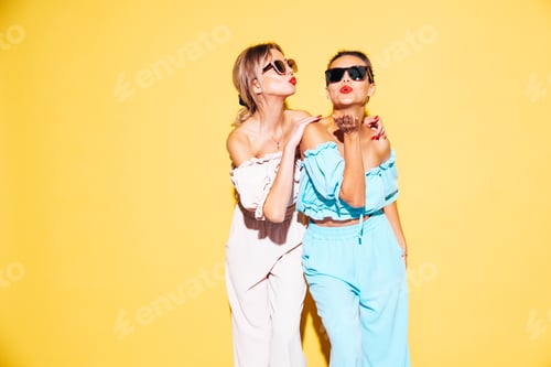 Preview: Two beautiful brunette women in studio