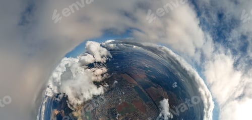 Preview: Aerial view from high altitude of little planet with distant city