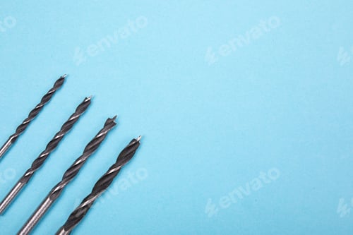 Preview: Set of drills are spread out in a row on blue background