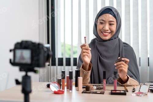 Preview: Woman Muslim blogger is showing present make up tutorial beauty cosmetic review product and live