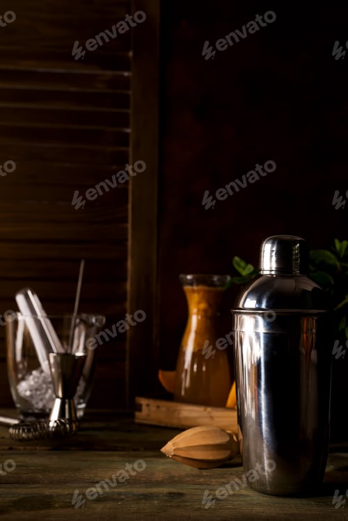 Preview: Cocktail shaker, swizzle, tongs and spoon with ice in a bucket for preparing a summer cocktail
