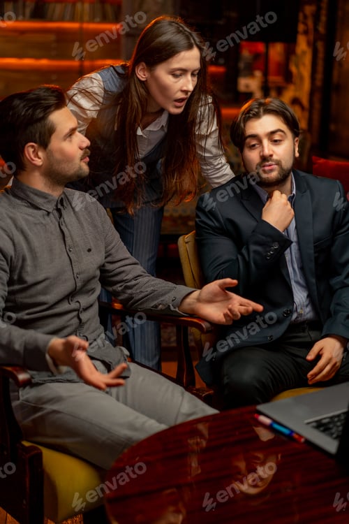 Preview: office sitting yellow chairs two male workers discuss a project with a female director scolding