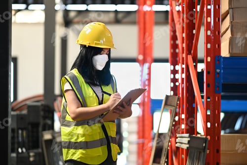 Preview: Asian woman warehouse workers using digital tablet between rows of tall shelves full of packed boxe