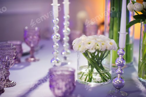Preview: decoration of the evening festive dinner with flowers on the wedding table in the interior of the