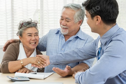 Preview: Senior couple making purchase property and handshake with agent
