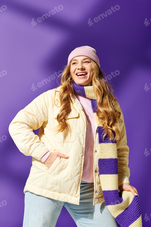 Preview: Joyful young plus size woman embraces colorful fashion against a vibrant purple background