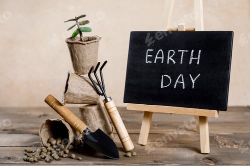 Preview: Save earth planet world concept - garden toolset, shovel, rake, flowerpots and tree sprouts.