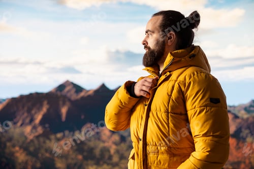 Preview: Adventure seeker gazes at the valley and mountain peaks ahead