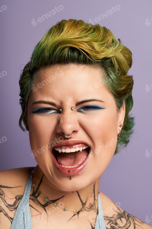 Preview: Vibrant young woman with bold makeup expresses joy against a pastel purple backdrop