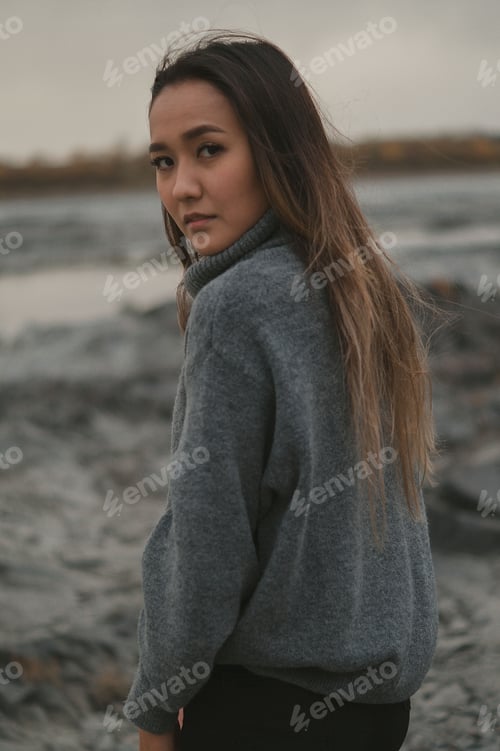 Preview: Woman in Gray Sweater Over Looking Backwards