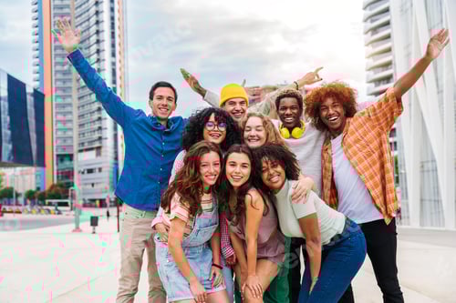 Preview: Happy playful multiethnic group of young friends bonding outdoors