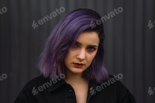 Preview: portrait of a sexy woman with purple hair and red lipstick on the black wall background