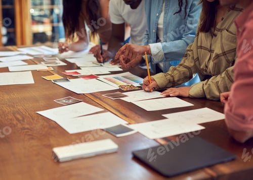 Preview: Close Up Of Team Having Creative Design Meeting Around Wooden Table In Office