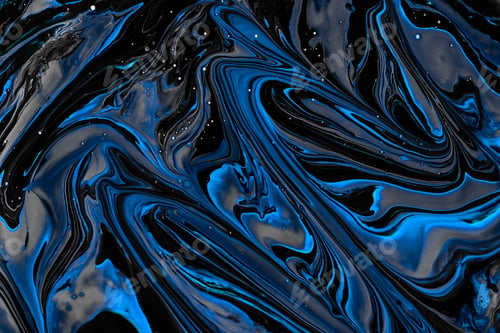 Preview: Close-up shot of thick paint of various bright colors flowing down and mixing together