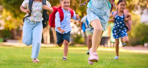 Preview: Close Up Of Primary Or Elementary School Students With Backpacks Running Outdoors At End Of Day
