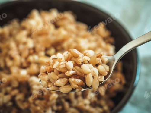 Preview: boiled spelt in spoon, selective focus