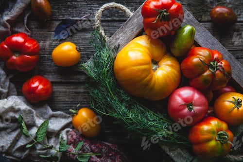 Preview: Fresh tomatoes in an old box. On wooden background