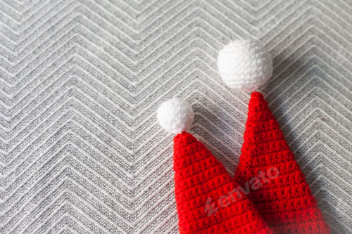 Preview: crocheted Santa Claus hats for Christmas party horizontal background