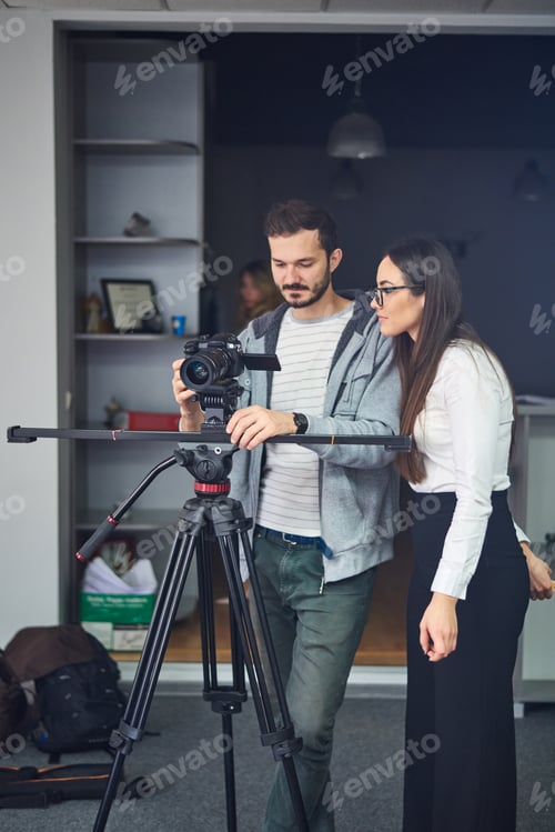 Preview: Cameraman showing the footage to the actor