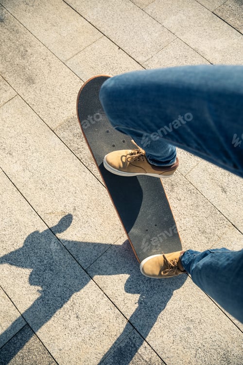 Preview: Skateboarder skateboarding outdoors on sunny morning