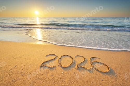 Preview: 2026 text symbol of new year on the sea sand beach shore during sunset.