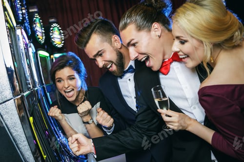 Preview: Group of friends playing slot machines in casino