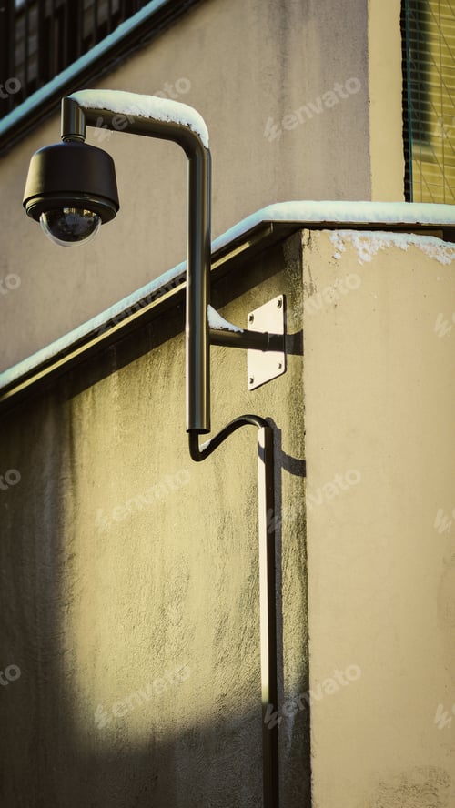Preview: Close-up shot of a security camera standing in front of a multi-story building, Kamppi, Finland