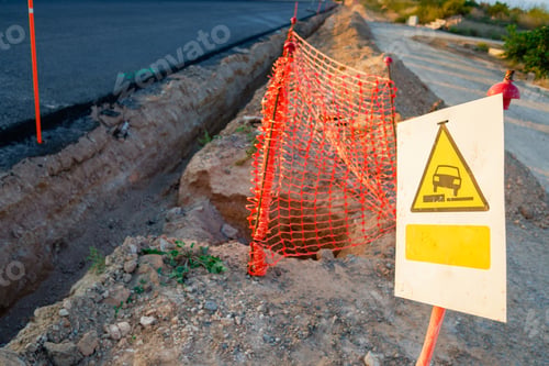 Preview: Danger traffic sign, unevenness, in a road paving work.