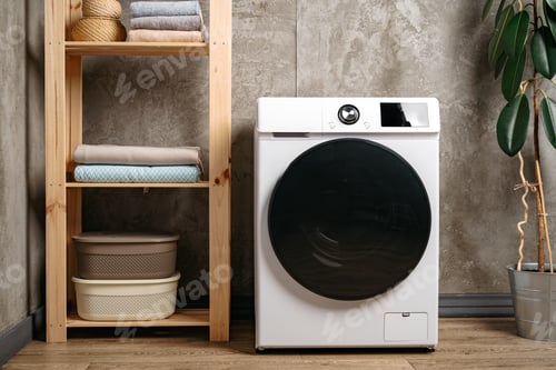 Preview: Washing machine in a gray modern laundry room