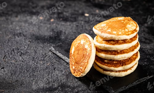 Preview: Ready made homemade pancakes on a stone board.