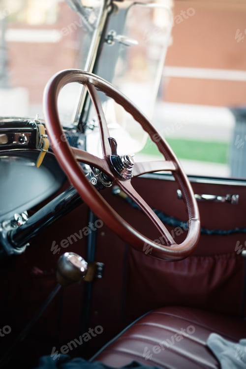 Preview: the driver's seat of an old car