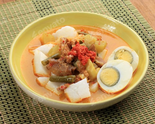 Preview: Lontong Sayur, Indonesian cuisine. Compressed rice cake or lontong with vegetables