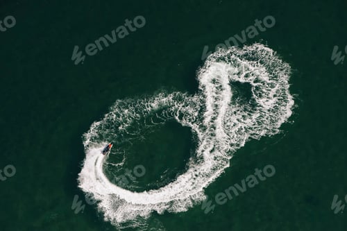 Preview: Aerial view of jet skier making figure of eight at sea, Melbourne, Victoria, Australia