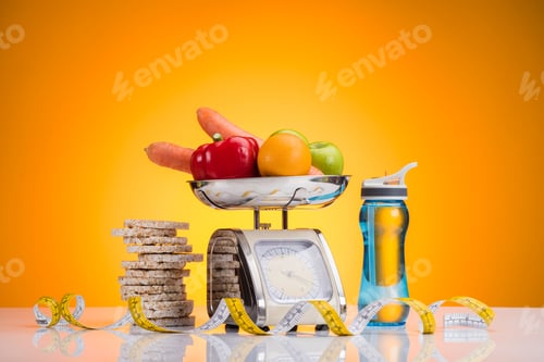 Preview: close-up view of fresh fruits and vegetables on scales, sports bottle with water and measuring tape