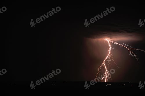 Preview: Lightning and storm clouds over the sea and the city.