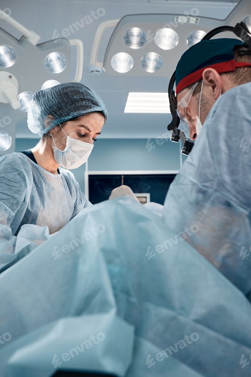 Preview: Close-up of surgeons in the operating room during the operation.Modern medicine, Medical workers