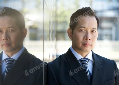 Preview: Businessman standing outdoors