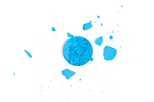 Preview: top view of blue cracked eyeshadow on white background