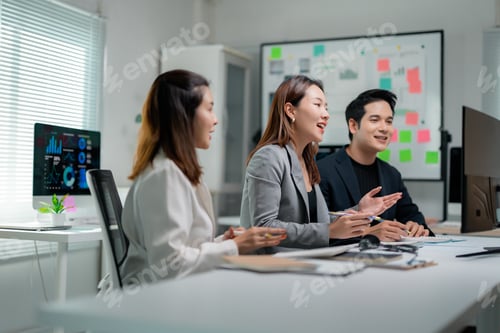 Preview: Business team discussing marketing strategy during video conference in modern office