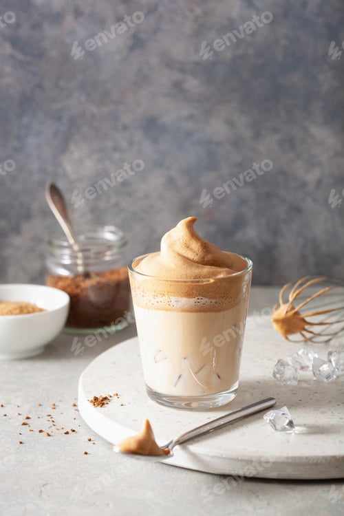 Preview: dalgona coffee in glass. trendy Instant coffee whipped with sugar and hot water