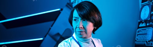 Preview: banner, Woman Scientist Records Data and Contemplates in Future Science Center