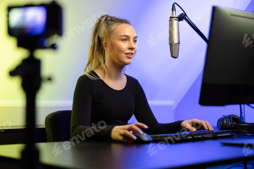 Preview: Professional e-sport gamer girl streaming live and plays online video game on PC