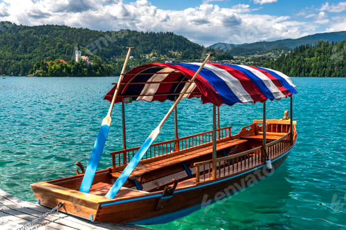 Preview: Woodden Boat on Lake Bled Emerald Green Water in Summer in Slovenia