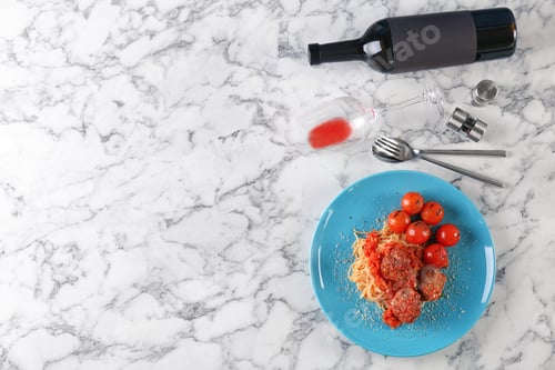Preview: Delicious pasta with meatballs and tomato sauce on light background, flat lay