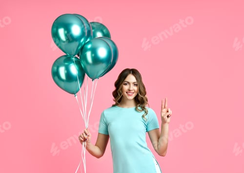 Preview: Smiling Woman with Teal Balloons on Pink Background